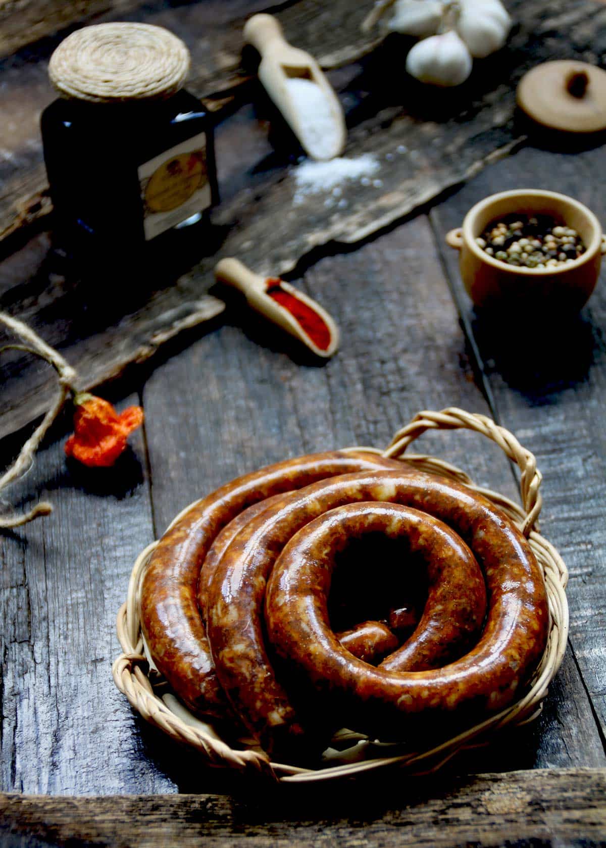 A coil of venison sausage on a table. 