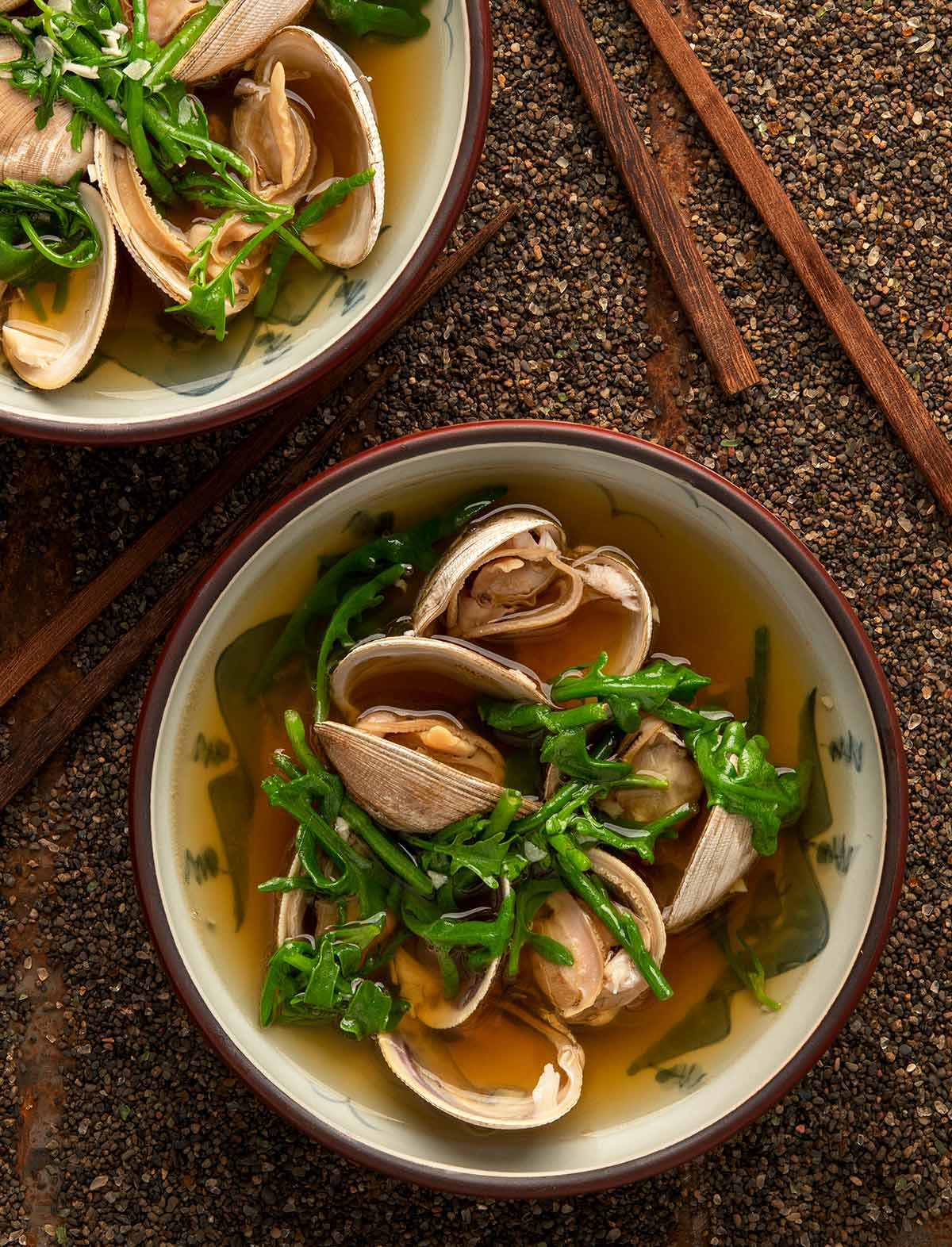 Two bowls of Japanese clam soup. 