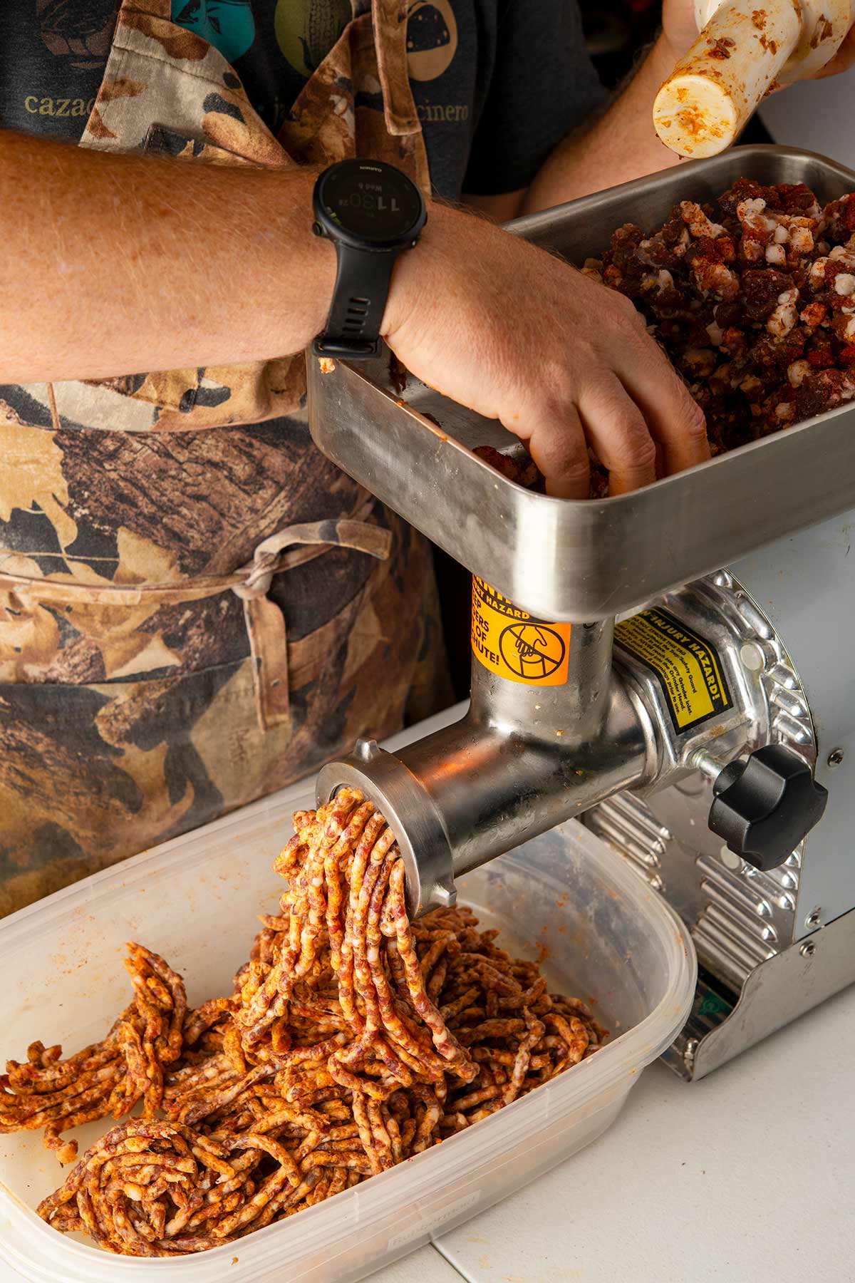 Making sausages: This is the second grind of the meat, into a plastic tub.