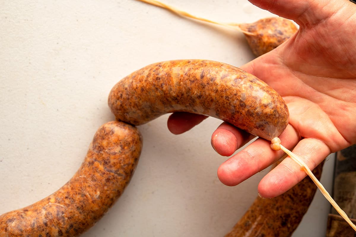 Homemade sausage links, tied off.