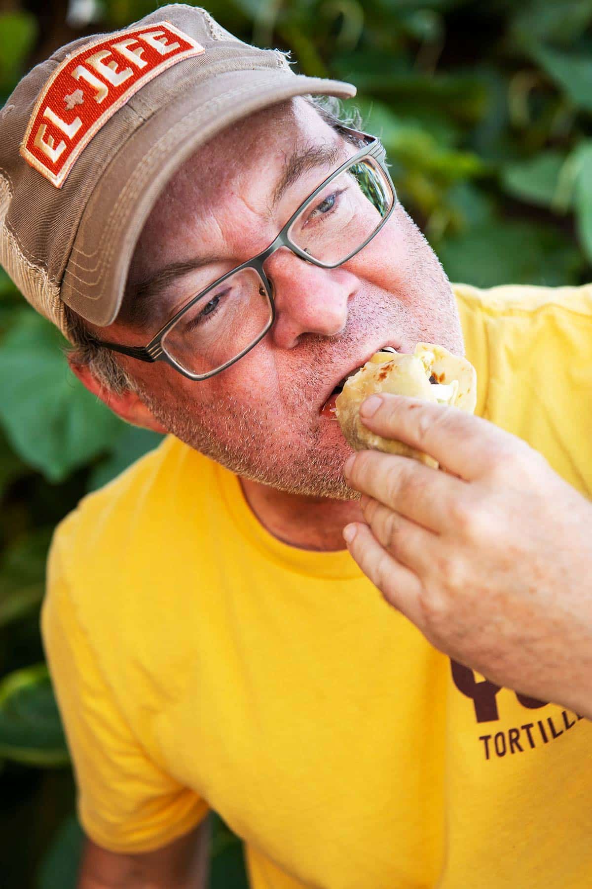 Hank Shaw eating a carne asada taco. 