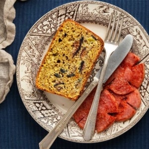 Fig bread with Taylor ham on a plate.