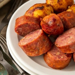 Texas hot links sliced on a plate.