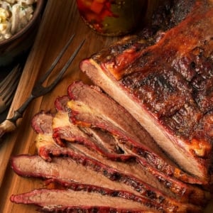 Slices of smoked bison brisket on a cutting board.