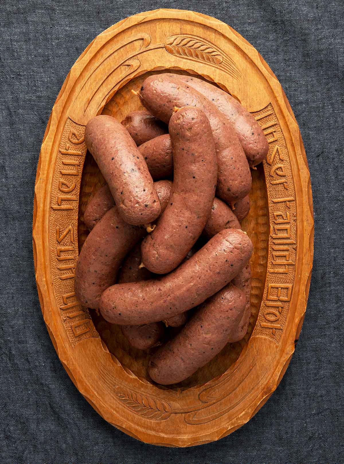 Braunschweiger links on a wooden platter. 