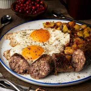 Swedish sausage served with eggs and potatoes.