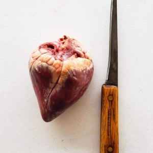 Getting ready to prepare deer heart with a sharp boning knife.