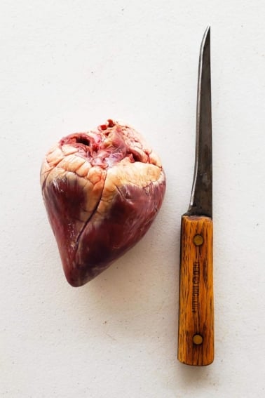 Getting ready to prepare deer heart with a sharp boning knife.