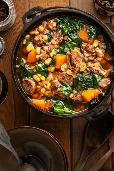 A pot of bison stew done three sisters style, with corn, beans and squash.