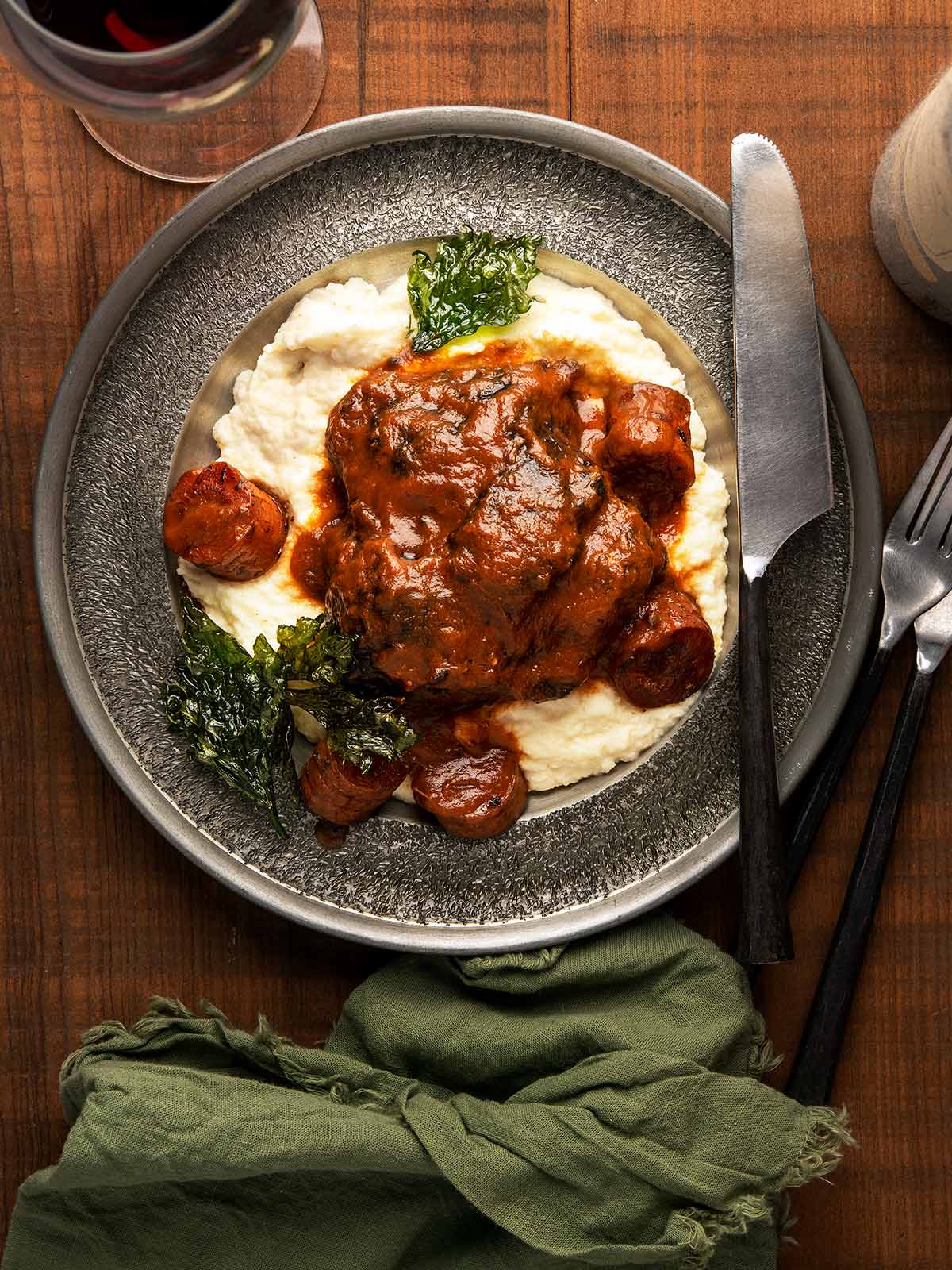 Red wine braised beef cheeks over mashed potatoes.