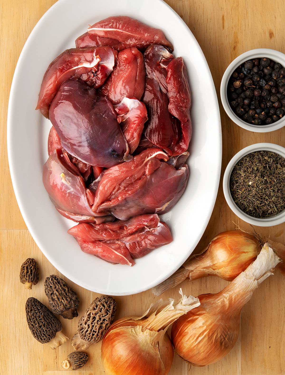 Ingredients for a game pie: grouse, onions, mushrooms and herbs. 