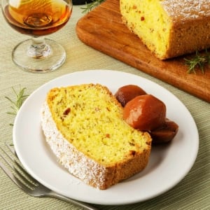 Close up of a slice of olive oil rosemary cake.