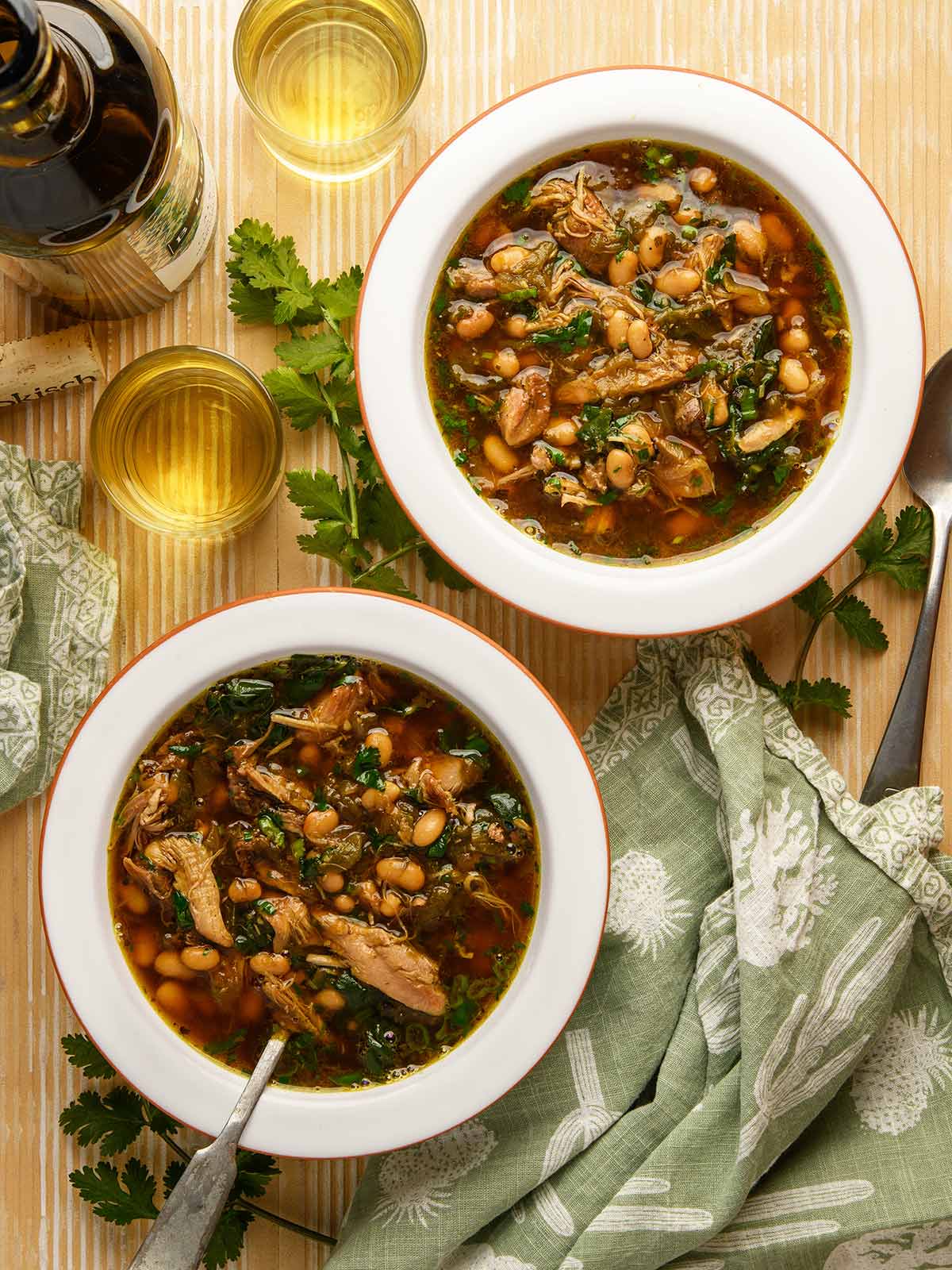 Two bowls of green chile chicken soup, ready to eat. 