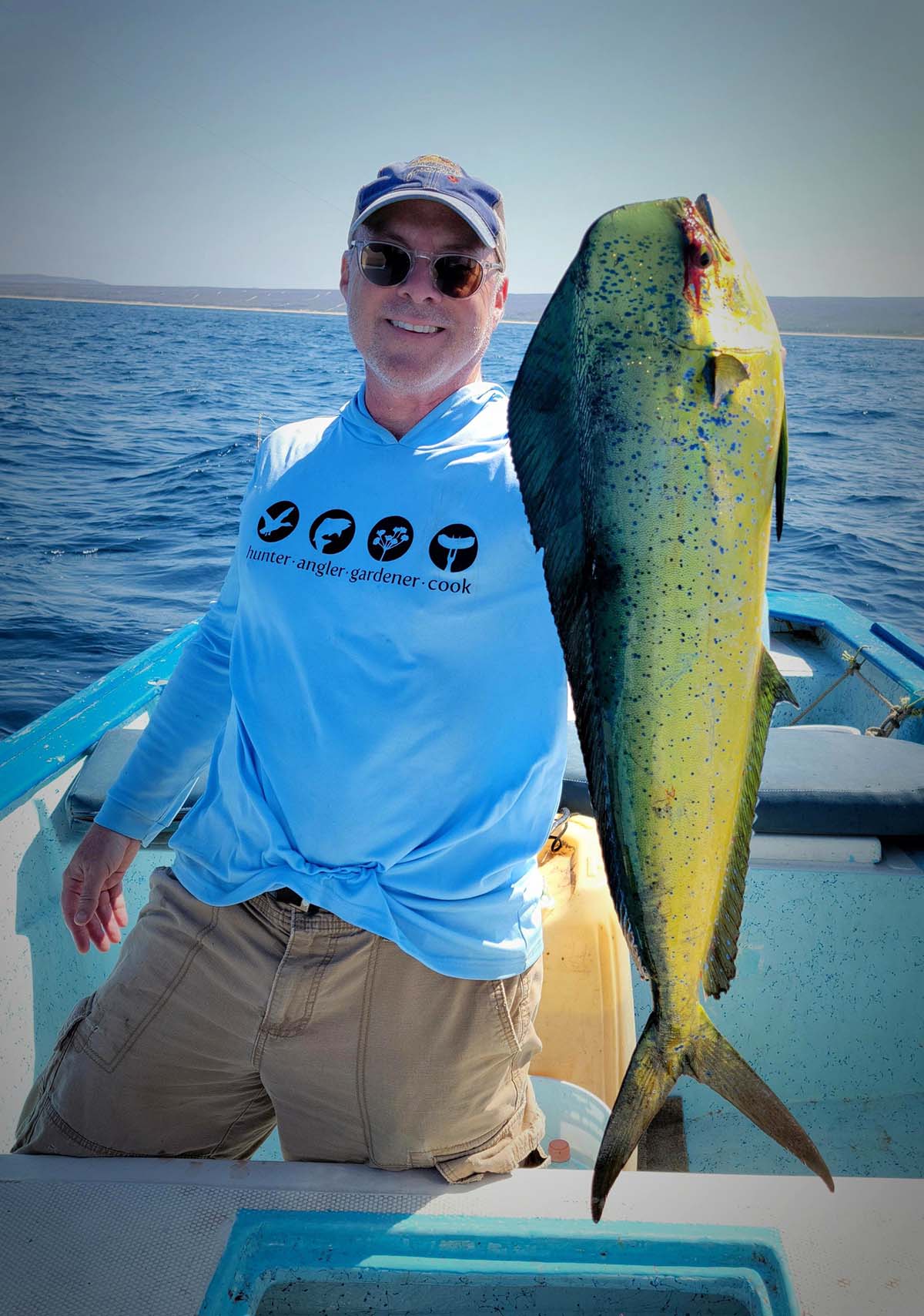 Hank Shaw holding a mahi mahi in Baja, Mexico. 