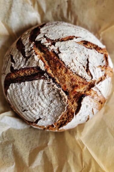 A loaf of rye sourdough bread cooling.