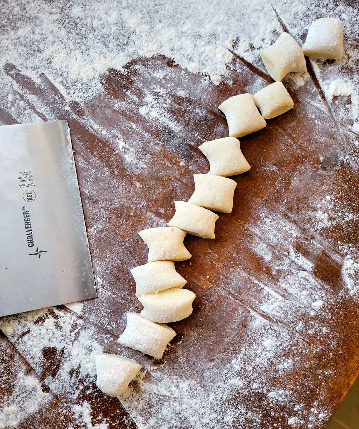 Dough for shupfnudeln cut out on a floured work surface. 