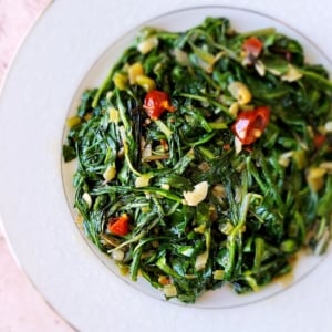 Sauteed dandelion greens on a plate.