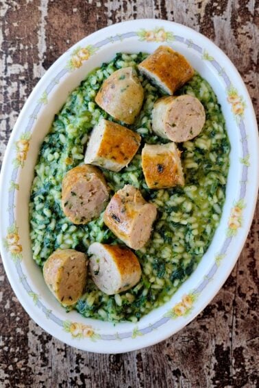 A platter of green onion sausage served over herbed rice.