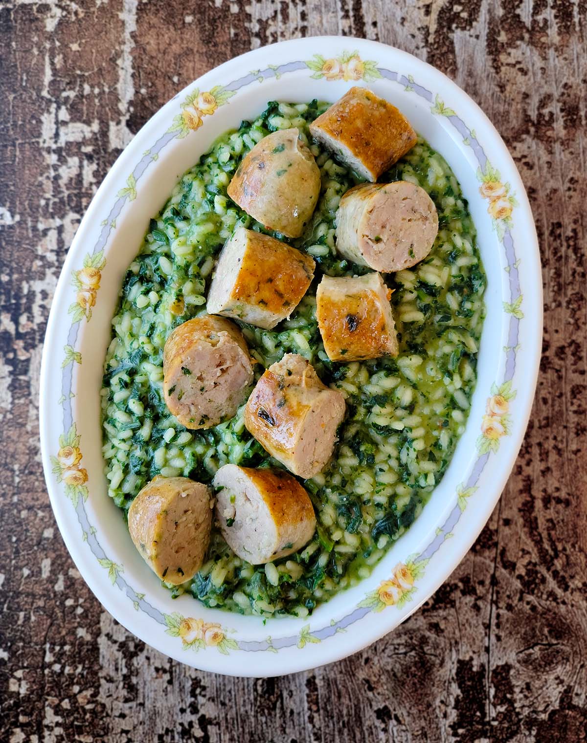 A platter of green onion sausage served over herbed rice. 