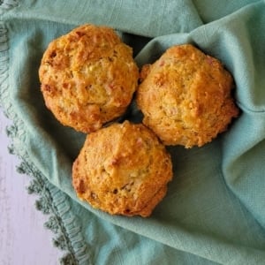 Close up of rhubarb muffins on a tea towel.