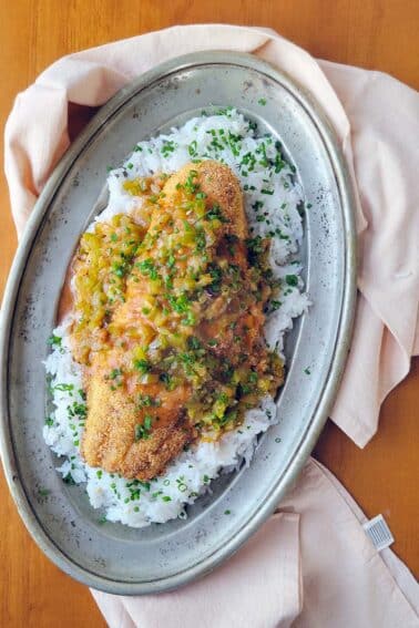 A platter of catfish etouffee over white rice.